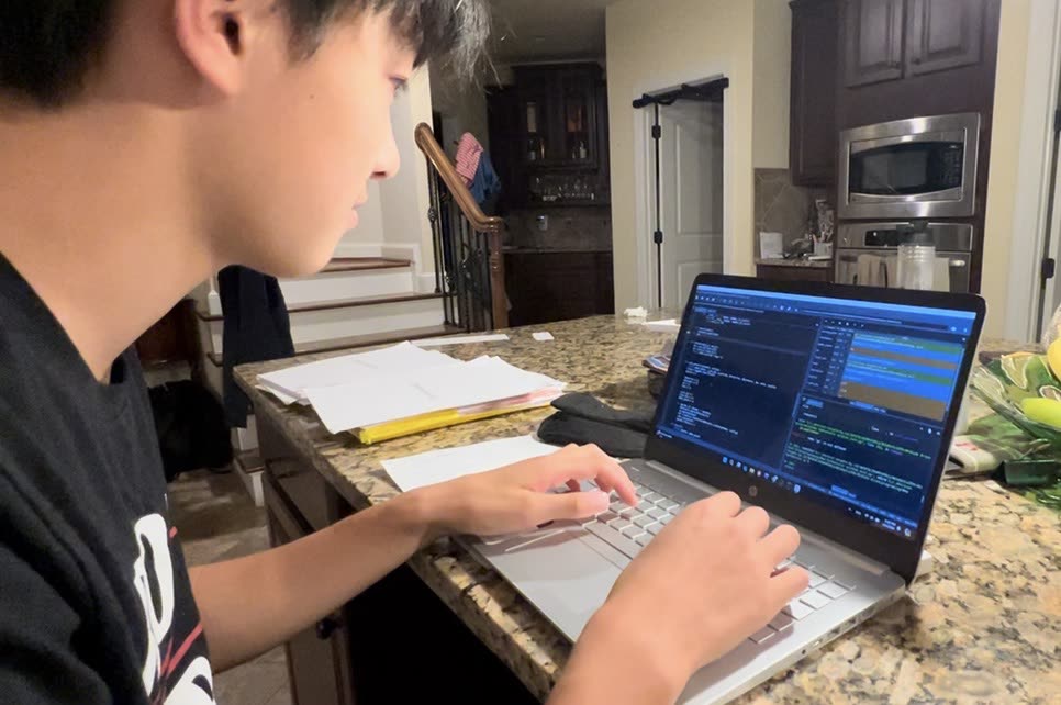 Eric developing the ParkinsonAI prototype on his laptop